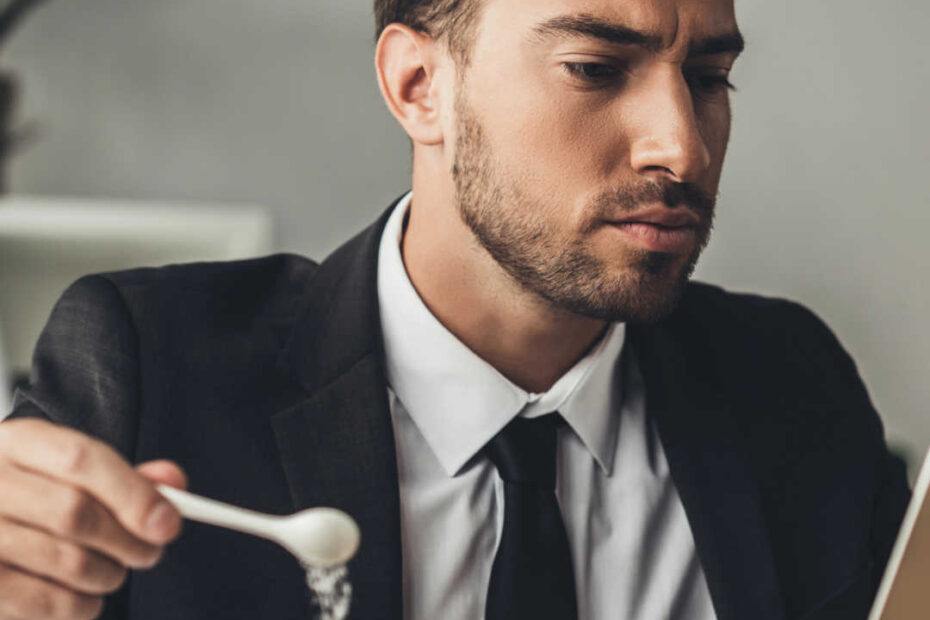 man reading while having coffee