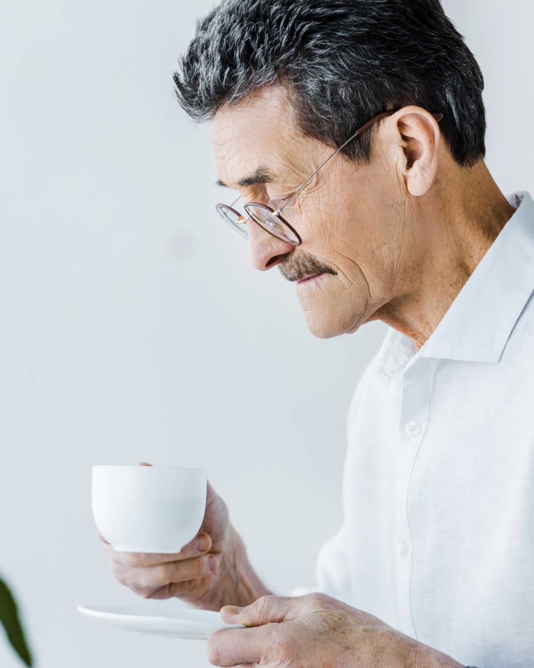 older man drinking coffee