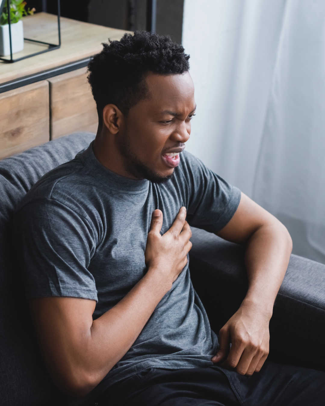 man grabbing heart