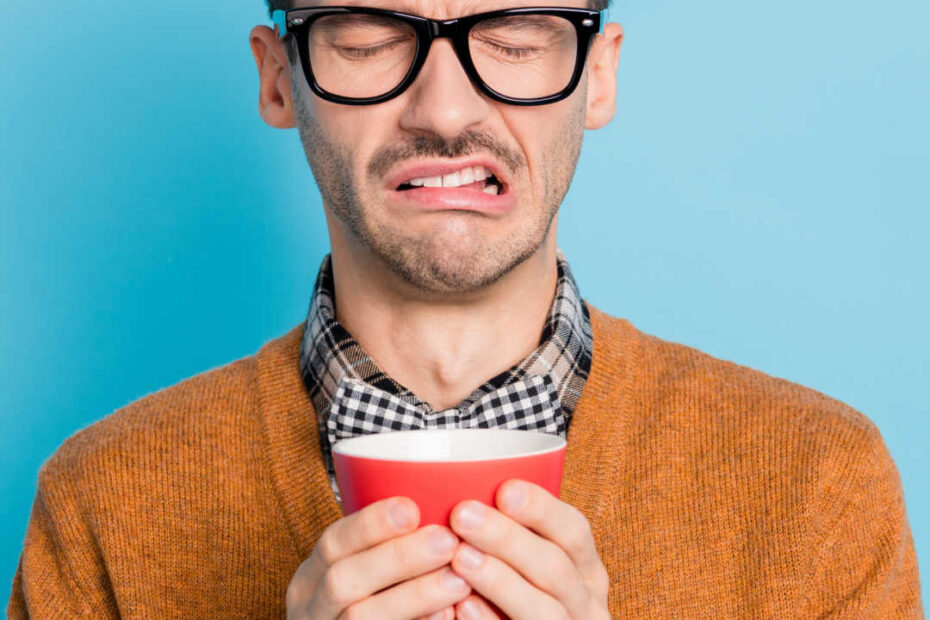 man reacting to bad coffee