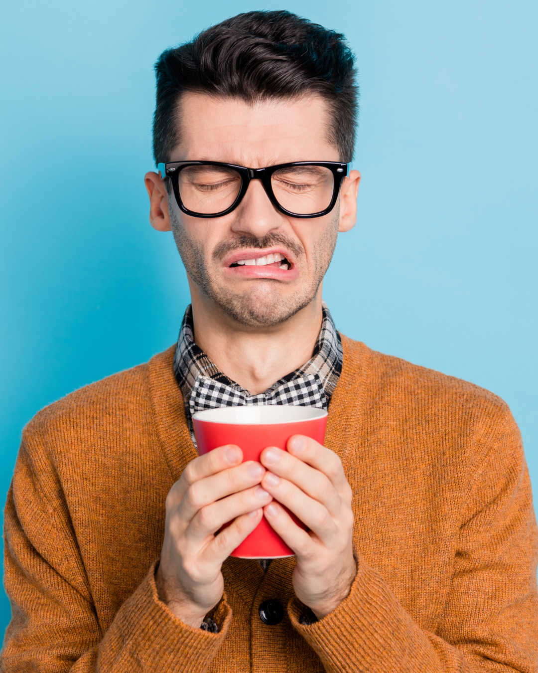 man reacting to bad coffee