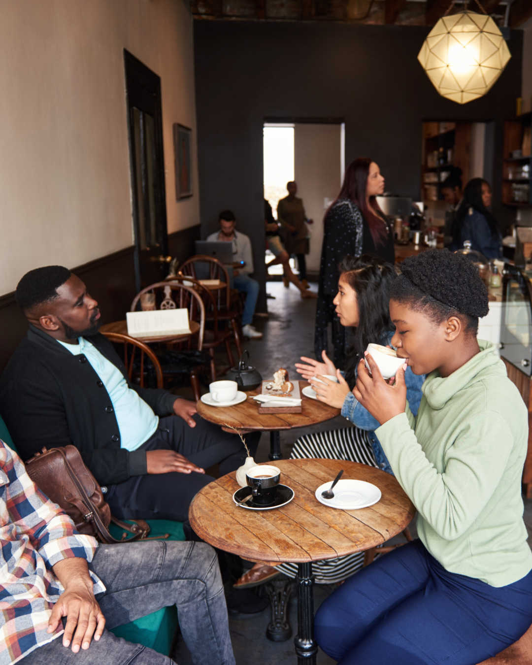 group in cafe drinking coffee