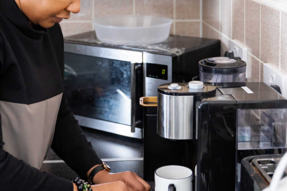 woman in kitchen making coffee