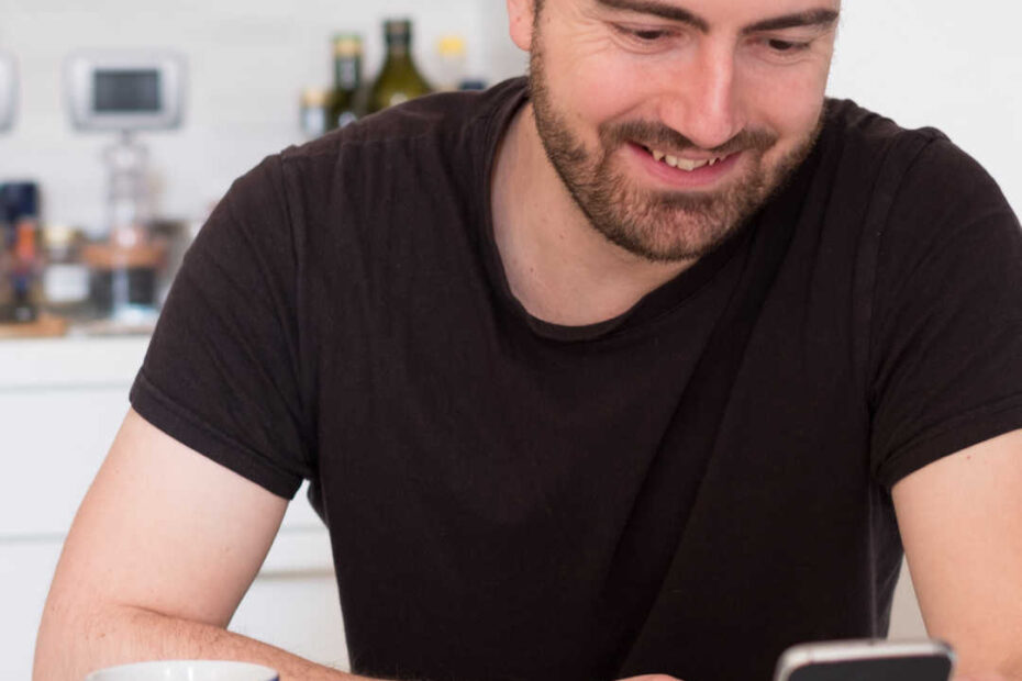 man reading news on phone