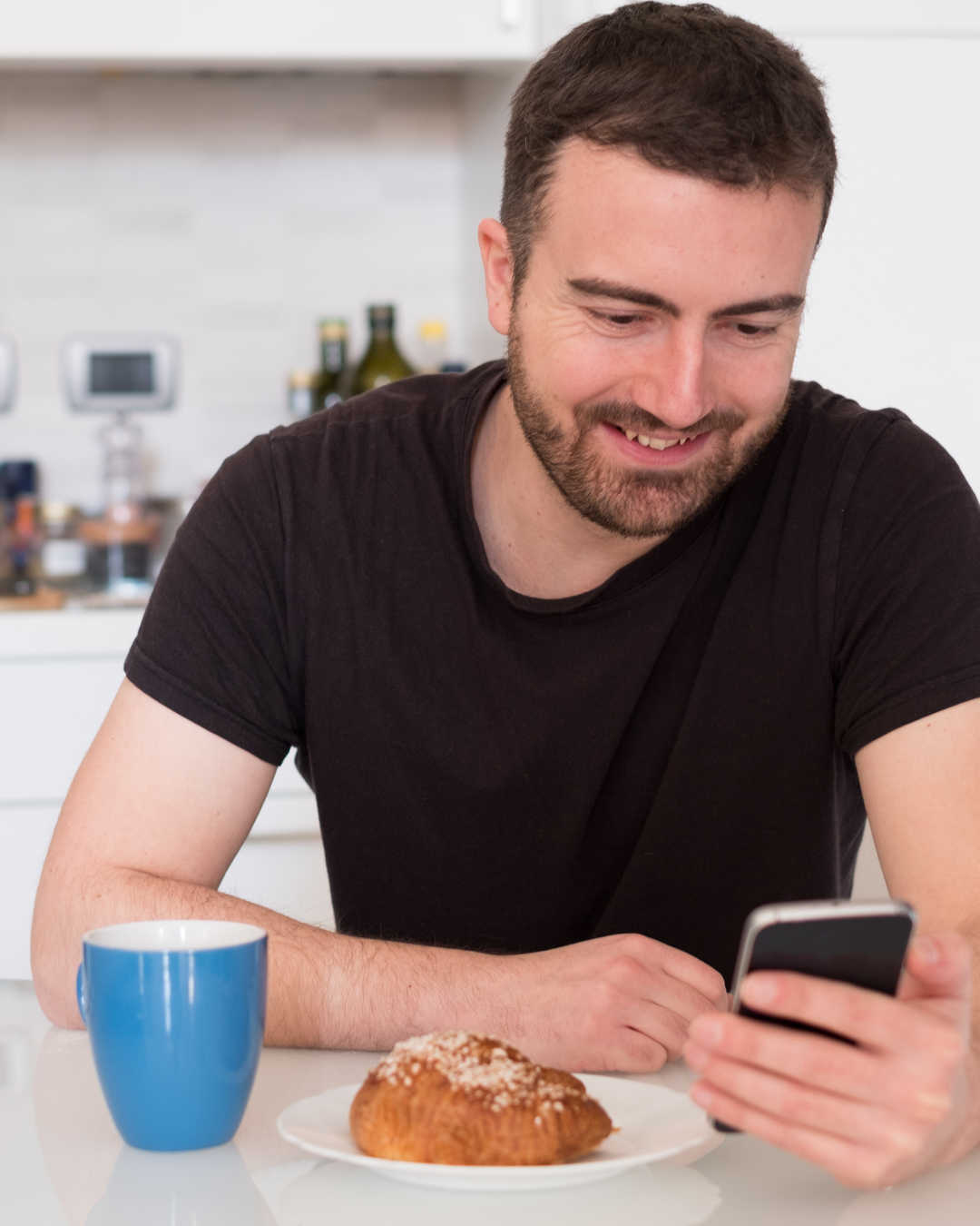 man reading news on phone