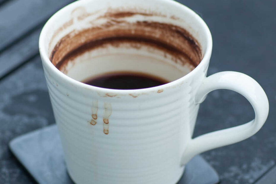 well-used coffee cup on table