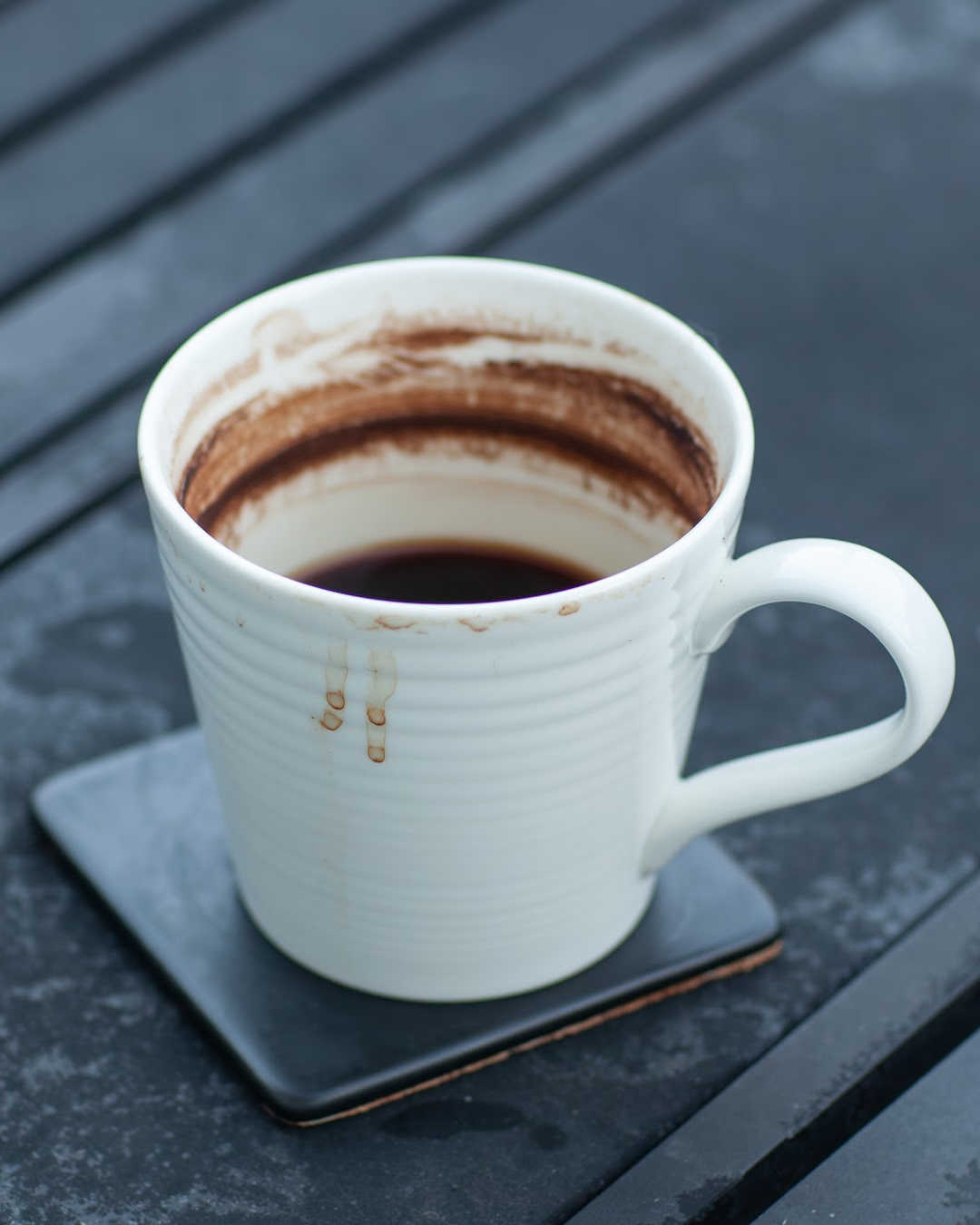 well-used coffee cup on table