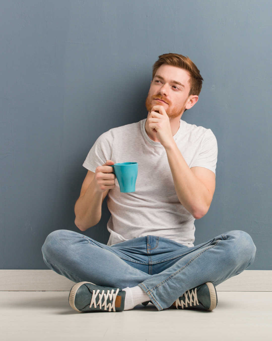 man thinking with coffee