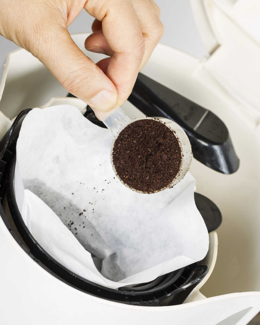 pouring coffee into paper filter